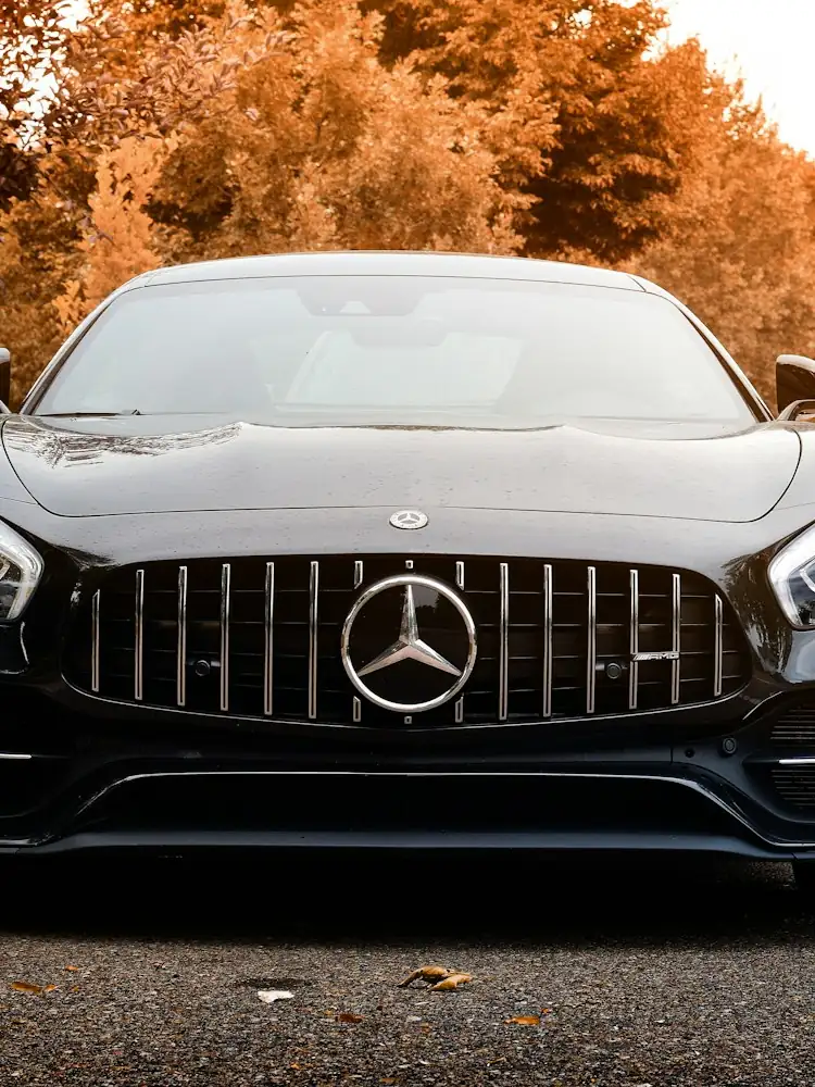 Black executive sedan photographed head-on.